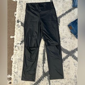 Boutique faux leather leggings with slit in knee